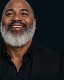 Timothy Thomas smiling, dynamic angle portrait